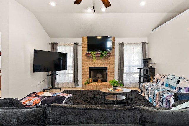 living room with recessed lighting, a brick fireplace, ceiling fan, and vaulted ceiling