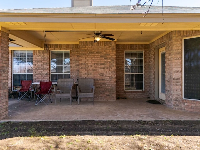 view of patio featuring ceiling fan