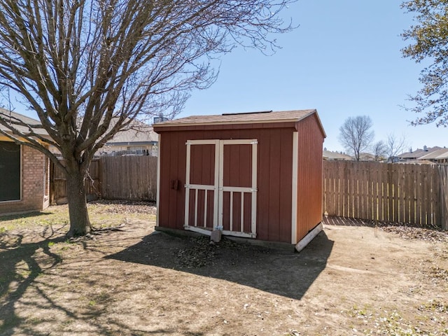 view of shed featuring a fenced backyard