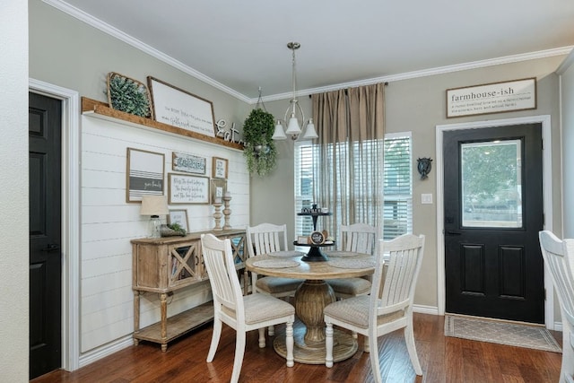 dining space featuring ornamental molding, baseboards, and dark wood-style flooring