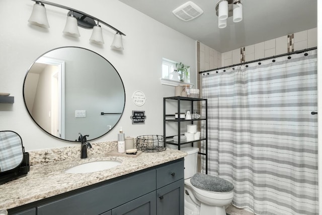 bathroom with visible vents, curtained shower, toilet, and vanity