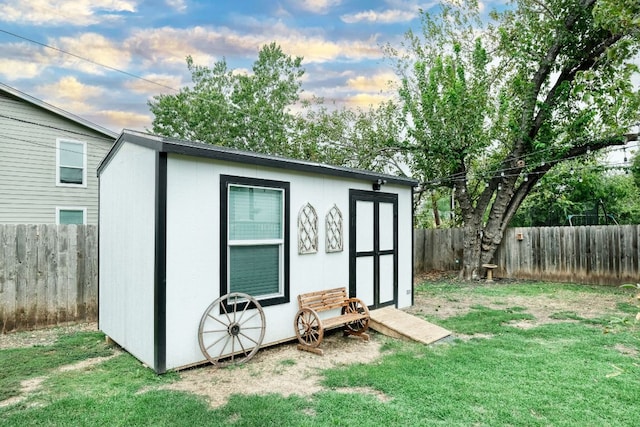 view of shed with a fenced backyard