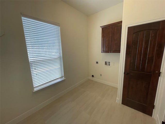 108 E Tanglebriar Ct, Bastrop, TX 78602 - washroom with electric dryer hookup, cabinet space, and hookup for a washing machine