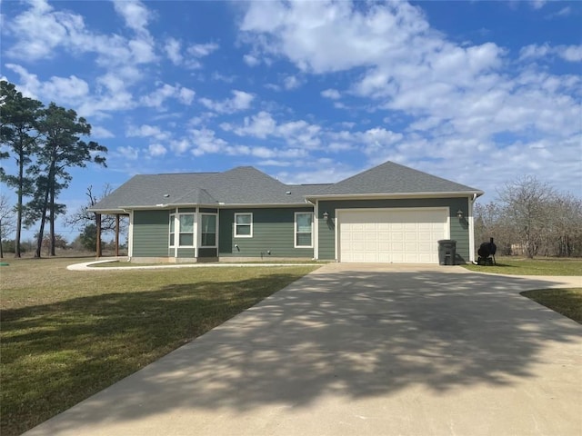 view of front of property featuring driveway, an attached garage, roof with shingles, and a front lawn