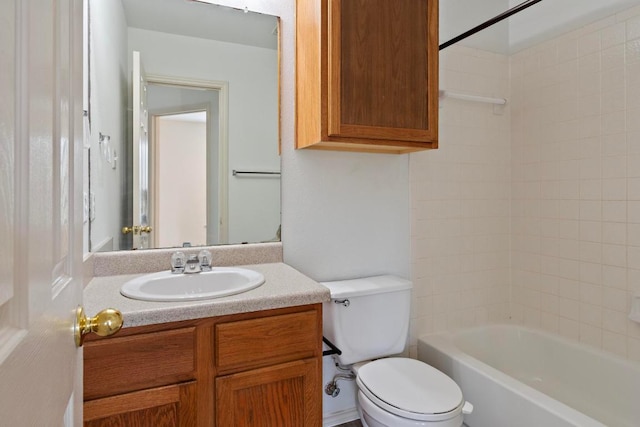 bathroom featuring vanity, bathing tub / shower combination, and toilet