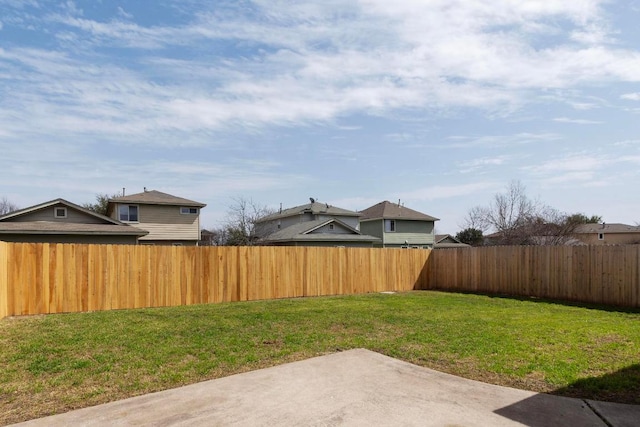 view of yard featuring a patio and a fenced backyard