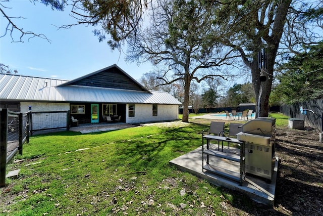 view of yard with a patio area, an outdoor pool, and a fenced backyard