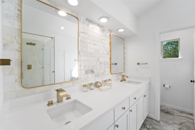 bathroom featuring double vanity, a stall shower, marble finish floor, and a sink