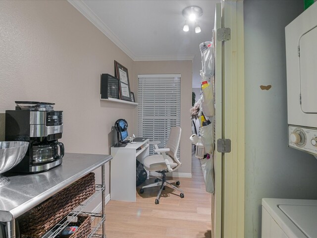 office area with light wood-style floors and ornamental molding