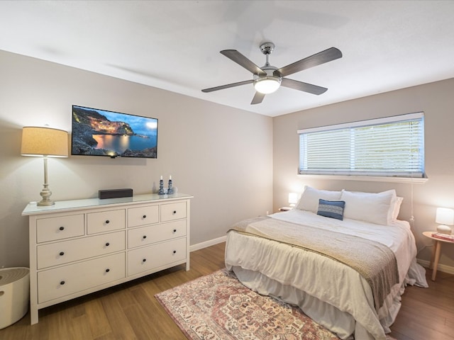 900 S Lamar Blvd Unit 205, Austin, TX 78704 - bedroom featuring wood finished floors, baseboards, and ceiling fan