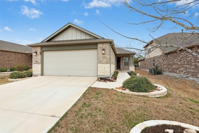 view of front of home featuring concrete driveway, a garage, stone siding, board and batten siding, and brick siding