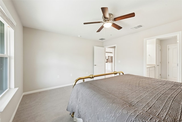 carpeted bedroom featuring visible vents, a ceiling fan, and baseboards