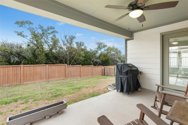 view of patio featuring a fenced backyard, a grill, and ceiling fan