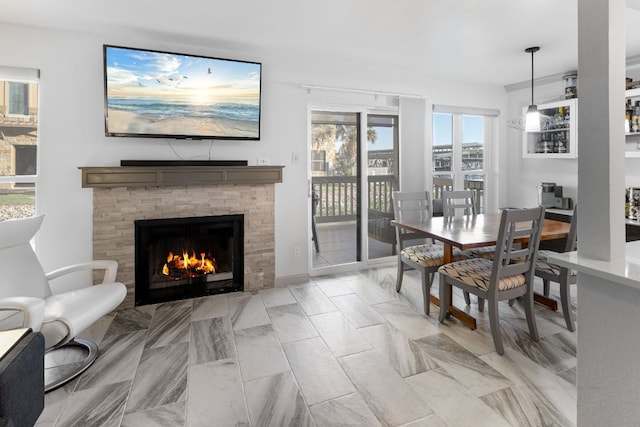 dining room with a fireplace with flush hearth