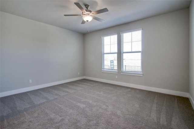 unfurnished room featuring baseboards, a ceiling fan, and carpet flooring