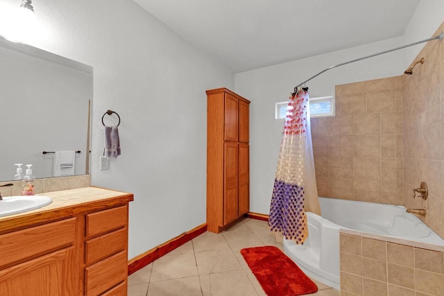 full bathroom featuring baseboards, shower / bath combo with shower curtain, vanity, and tile patterned flooring