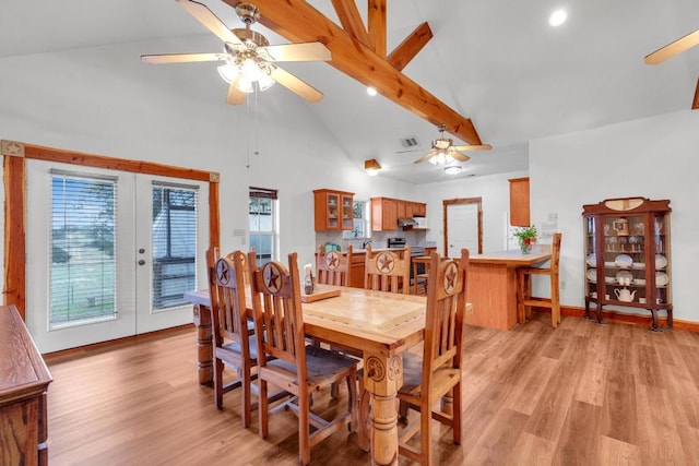 dining area featuring a ceiling fan, french doors, visible vents, and light wood finished floors