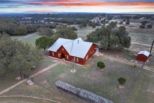 birds eye view of property featuring a rural view