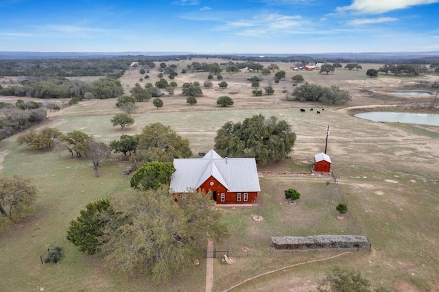 birds eye view of property with a rural view