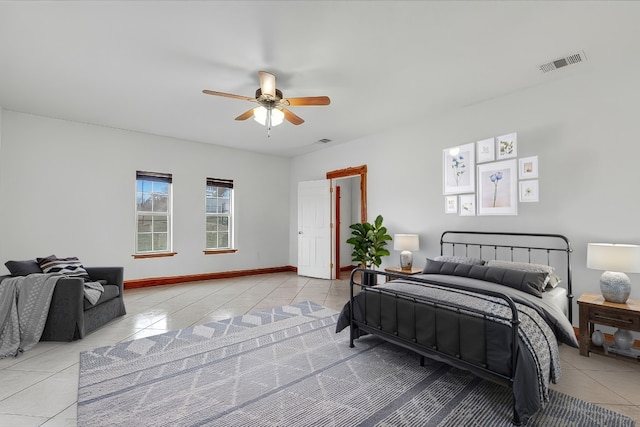 bedroom with light tile patterned flooring, baseboards, visible vents, and ceiling fan