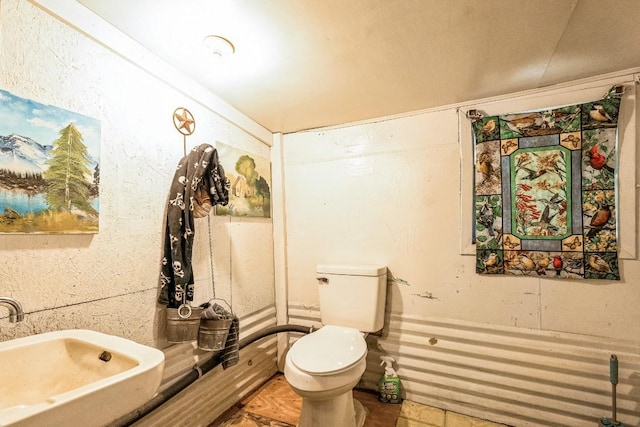 bathroom featuring toilet and a sink