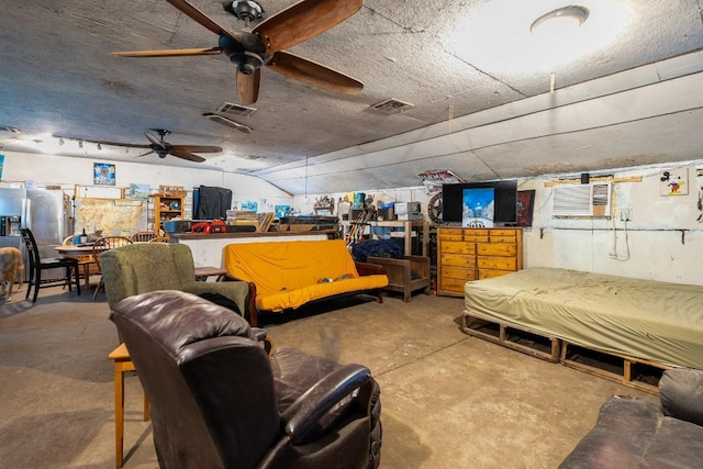 interior space featuring unfinished concrete floors, visible vents, and ceiling fan