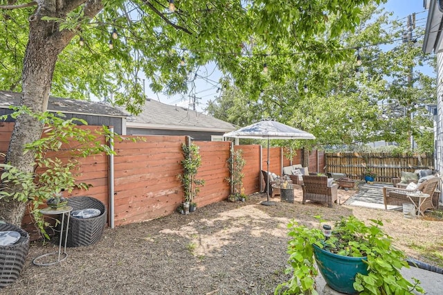 view of yard with an outdoor hangout area and a fenced backyard