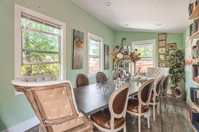 dining room with lofted ceiling, recessed lighting, wood finished floors, and a healthy amount of sunlight