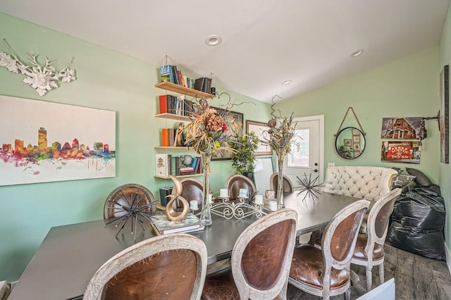 dining room with recessed lighting, lofted ceiling, and wood finished floors