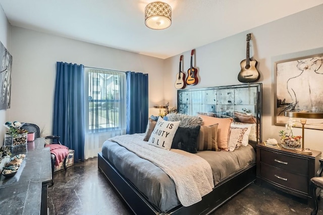 bedroom featuring finished concrete flooring