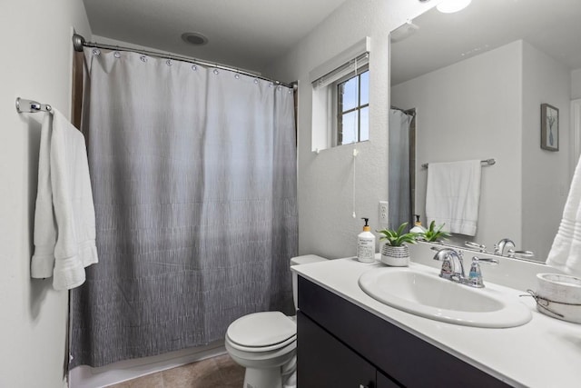 full bathroom featuring vanity, toilet, a shower with curtain, and tile patterned flooring