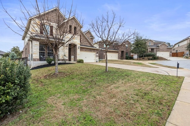 view of front of house with brick siding, an attached garage, a front yard, stone siding, and driveway