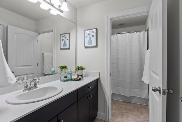 full bath featuring vanity and tile patterned flooring