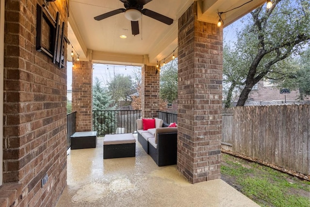 view of patio featuring fence and ceiling fan