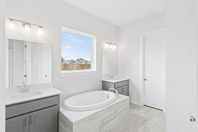 4419 College Square Dr, Round Rock, TX 78665 - full bathroom featuring a sink, a garden tub, and two vanities