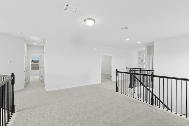 4419 College Square Dr, Round Rock, TX 78665 - hall featuring attic access, visible vents, an upstairs landing, light carpet, and recessed lighting