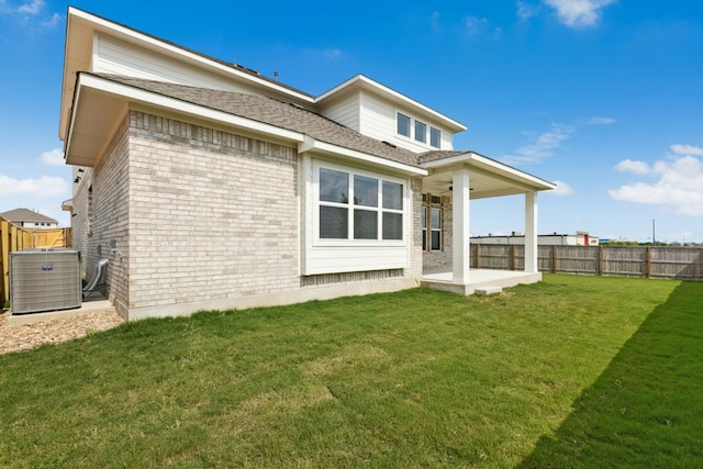 4419 College Square Dr, Round Rock, TX 78665 - rear view of property featuring cooling unit, a patio, a fenced backyard, a shingled roof, and a yard