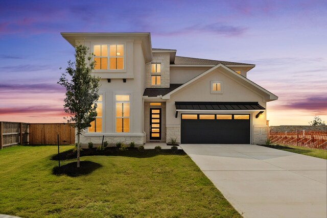 4419 College Square Dr, Round Rock, TX 78665 - contemporary house featuring fence, driveway, stone siding, and a front lawn