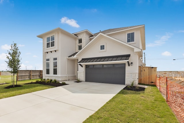 4419 College Square Dr, Round Rock, TX 78665 - view of front of home with fence, a front lawn, concrete driveway, stone siding, and stucco siding