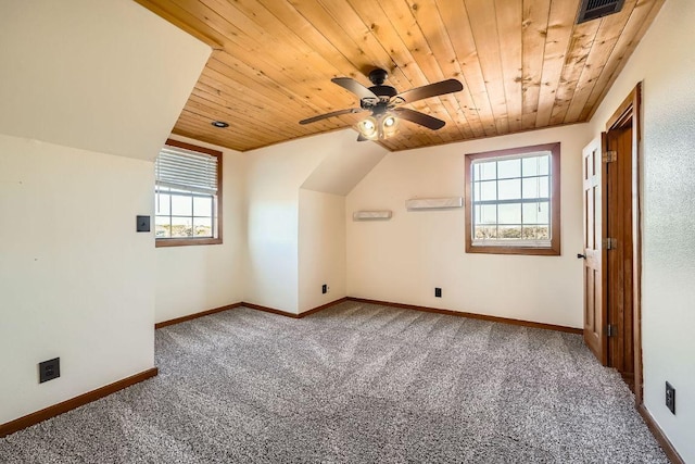 additional living space with visible vents, baseboards, carpet, wood ceiling, and a ceiling fan