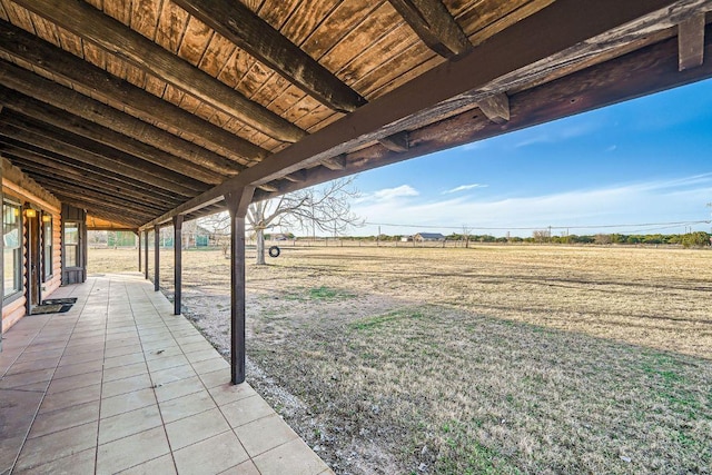 view of yard featuring a rural view and a patio