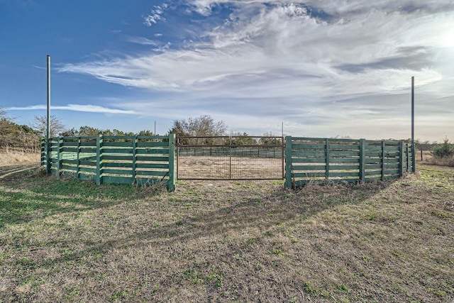 exterior space featuring a rural view and fence