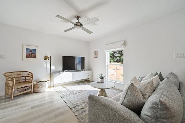 living room featuring ceiling fan and wood finished floors