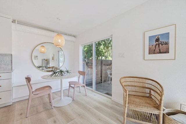 dining area featuring light wood-type flooring