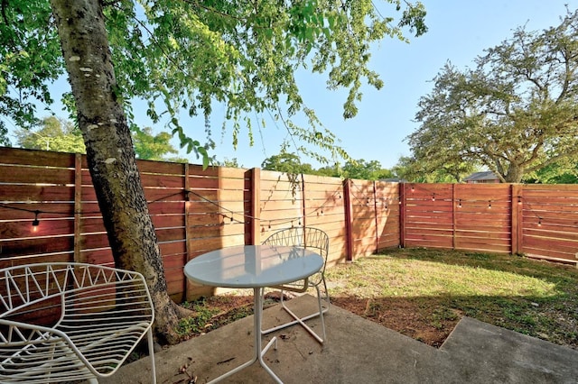 view of patio featuring a fenced backyard