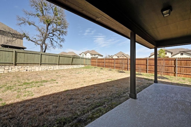 view of yard featuring a patio and a fenced backyard