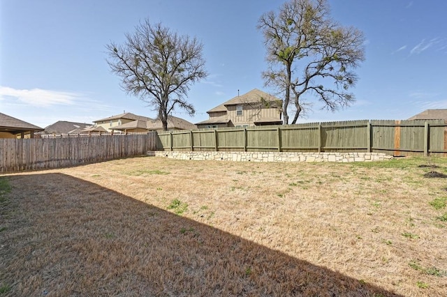 view of yard featuring a fenced backyard