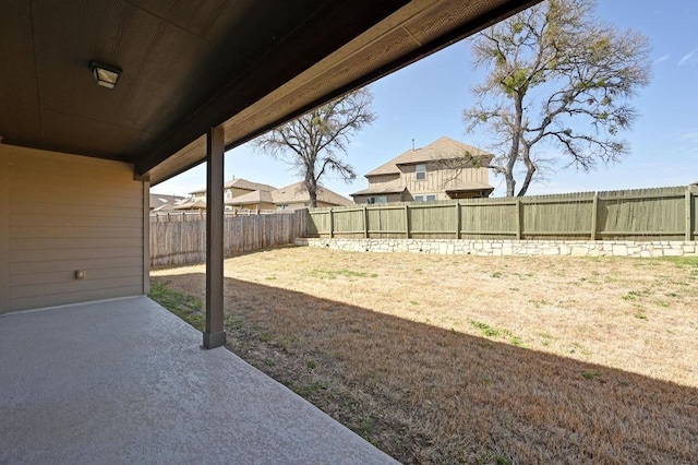 view of yard with a patio and a fenced backyard