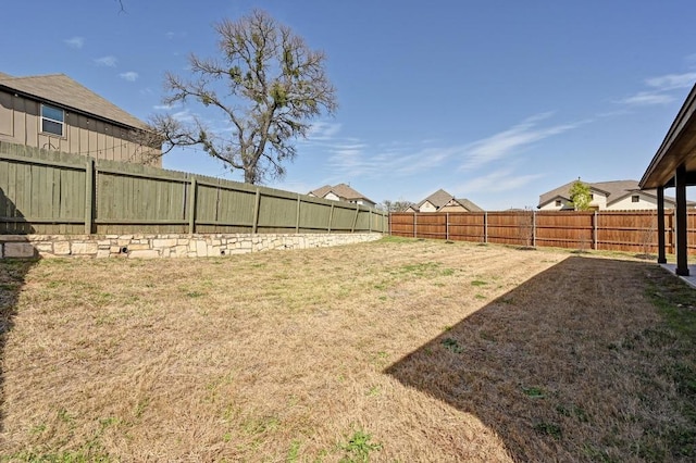 view of yard with a fenced backyard