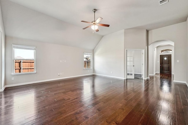 unfurnished living room with baseboards, visible vents, high vaulted ceiling, dark wood finished floors, and ceiling fan